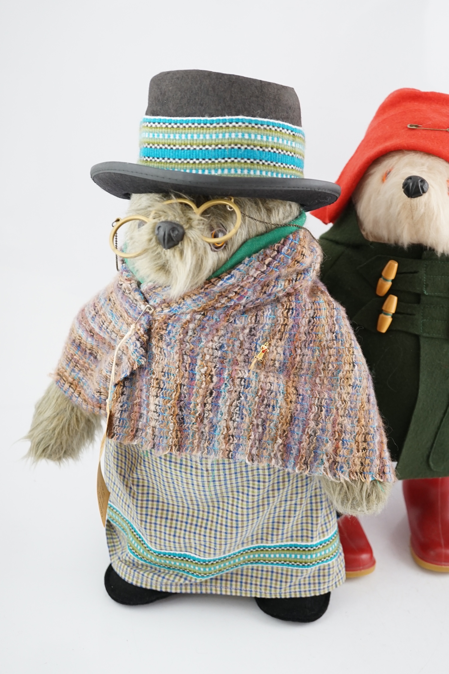 Aunt Lucy with glasses and label, in good condition, two Paddington bears, one with green jacket, Dunlop boots, in excellent condition, one in football outfit